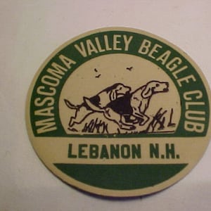 May include: A round, beige and green sticker with the text "Mascoma Valley Beagle Club Lebanon N.H." and a black and white illustration of three beagles running.