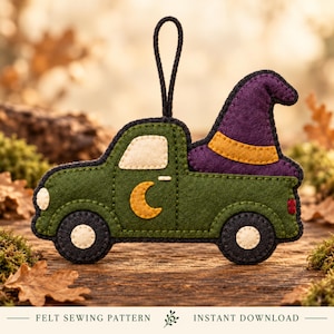 May include: A felt ornament shaped like a green pickup truck with a purple witch hat in the truck bed, a yellow crescent moon on the door, and a black hanging loop. The text at the bottom reads: FELT SEWING PATTERN INSTANT DOWNLOAD.