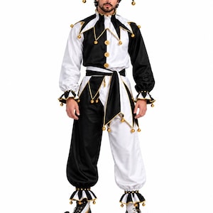 May include: A black and white jester costume featuring a long-sleeved tunic with a ruffled collar, matching trousers, and a two-pointed hat. The outfit is adorned with gold-coloured bells at the collar, cuffs, waist, hat tips, and ankles.
