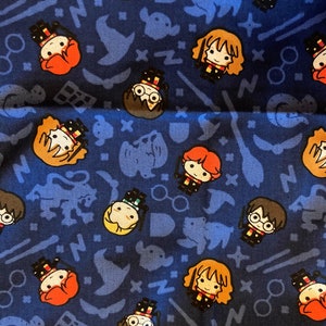 May include: A blue fabric with a repeating pattern of Harry Potter characters. The characters include Harry Potter, Ron Weasley, Hermione Granger, and Draco Malfoy. The fabric also features various Harry Potter themed symbols, such as the Hogwarts crest, a lightning bolt, and a snitch.