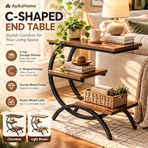 May include: A C-shaped end table featuring three tiers of wooden shelves with a dark brown finish and a curved black metal frame. The table displays books, a potted plant, a mug, and a woven basket on its surfaces. Text includes AyiksHome.