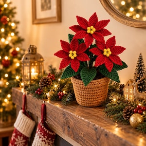 May include: A crocheted poinsettia plant with vibrant red petals and yellow centers, potted in a textured tan yarn container. The plant features dark green crocheted leaves and is displayed as a decorative item with a detailed stitch pattern.