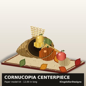May include: A paper model kit of a cornucopia centerpiece measuring 12.00 inches long. The cornucopia is filled with a yellow sphere, a striped green sphere, an orange pumpkin, a red apple, and a tan gourd, with wheat stalks and leaves.
