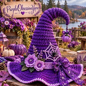 May include: A purple crocheted witch hat featuring a spiderweb applique with a small spider, two light purple crocheted flowers, and a dark purple ribbon with star and moon patterns. A small crocheted pumpkin hangs from the tip.