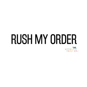 May include: Black text on a white background reads "Rush My Order". Below the text is a small, stylized deer in blue, green, and yellow with the text "urban baby co."