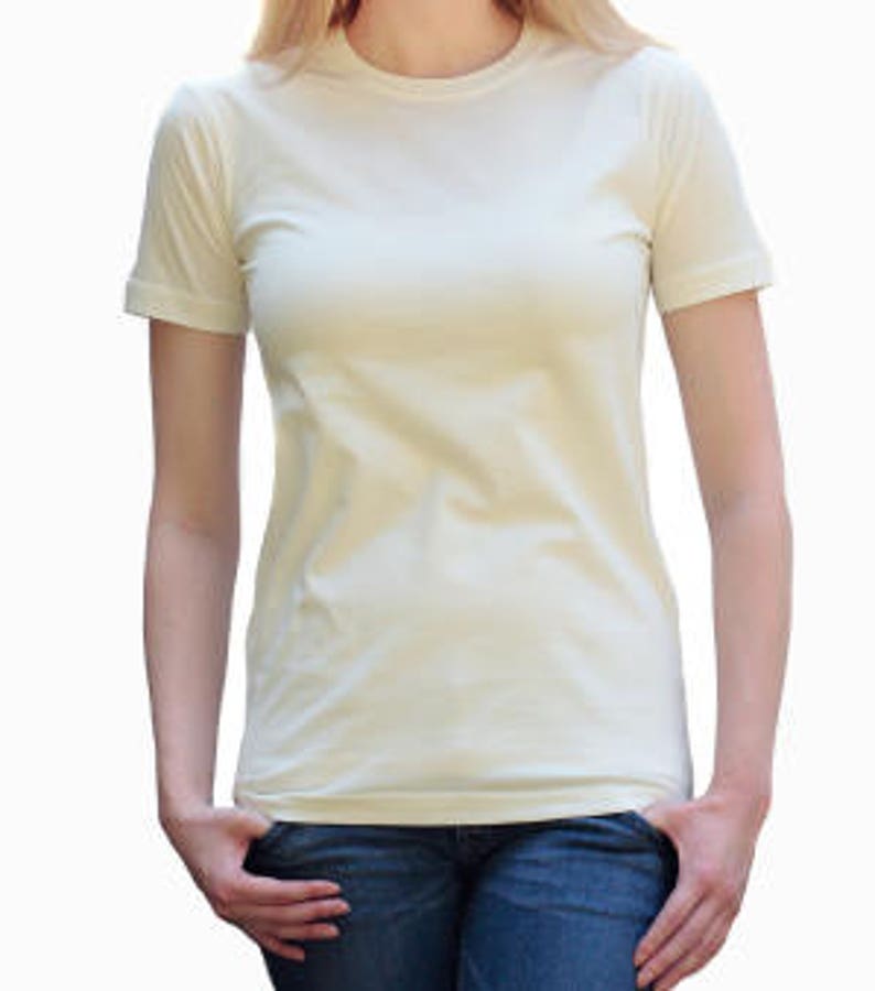 May include: A plain, off-white short-sleeved t-shirt.