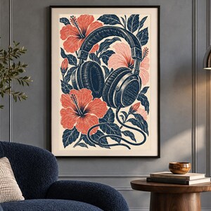 May include: A framed vertical wall art print featuring a detailed illustration of dark blue over-ear headphones intertwined with vibrant coral-colored hibiscus flowers and dark blue leaves against a light cream-colored background.