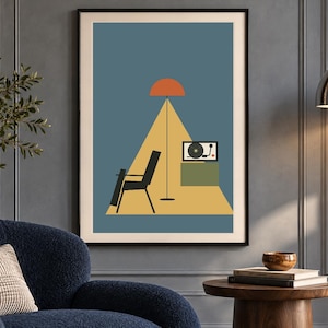 May include: A framed wall art print featuring a blue background with a yellow triangular floor area. The illustration depicts a black chair, a tall floor lamp with an orange shade, and a record player on a green cabinet within the yellow space.