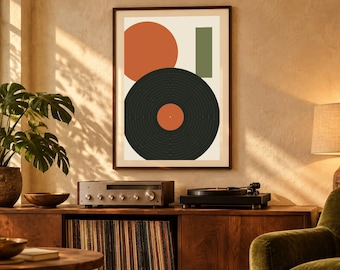 May include: A framed wall art print featuring a large orange circle, a vertical green rectangle, and a black vinyl record graphic with an orange center label, all arranged on a light cream background within a dark brown frame.