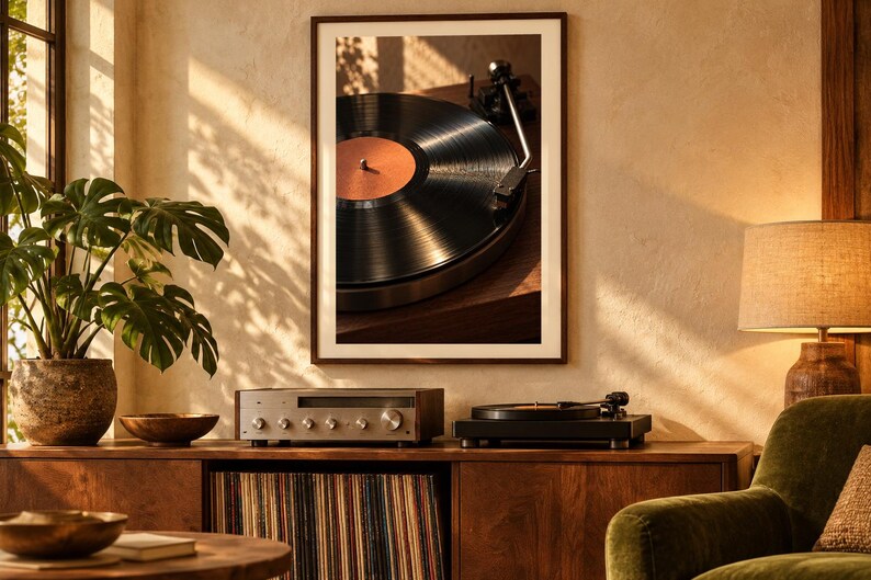 May include: A framed wall art print featuring a close-up of a black vinyl record spinning on a turntable with a copper-colored center label. The artwork is displayed above a wooden media console containing a silver receiver and a black turntable.