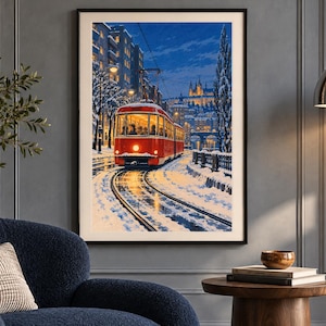 May include: A framed vertical wall art print depicting a bright red tram traveling along snow-covered tracks at night. The scene features illuminated city buildings, bare trees dusted with snow, and a glowing headlight on the tram.