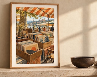 May include: A framed art print depicting an outdoor market scene with wooden crates filled with vinyl records. The scene features orange and white striped awnings, people walking near a waterfront, and a distant town under a bright sky.