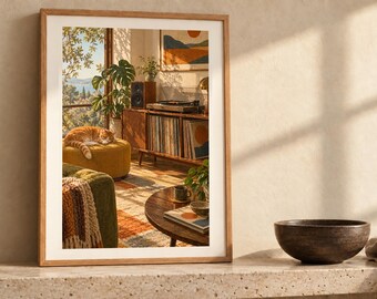 May include: A rectangular wooden frame containing a print of a sunlit living room scene featuring a sleeping orange tabby cat on a yellow ottoman, a record player on a wooden console, a green sofa, and a round coffee table.