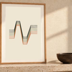 May include: A framed wall art print featuring a series of parallel horizontal lines that shift into a sharp, angular wave pattern. The lines are colored in shades of black, dark green, and muted orange against a light cream background.