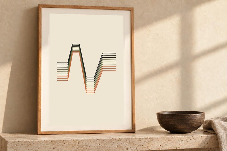 May include: A framed wall art print featuring a series of parallel horizontal lines that shift into a sharp, angular wave pattern. The lines are colored in shades of black, dark green, and muted orange against a light cream background.