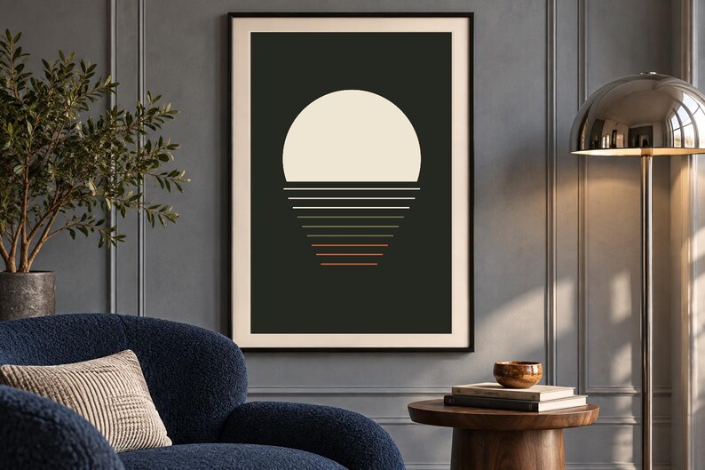 May include: A framed wall art print featuring a large cream-colored semi-circle sun positioned above a series of horizontal lines that transition in color from cream to orange, set against a solid dark charcoal background.