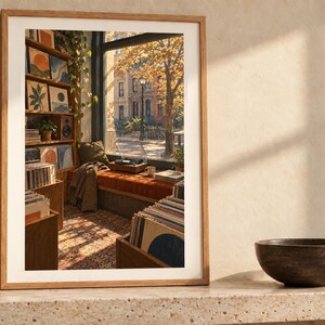May include: A framed art print depicting a cozy room interior with a window view of an autumn street, wooden shelves filled with records and framed art, a record player on a window seat, and a patterned rug in warm, golden sunlight.