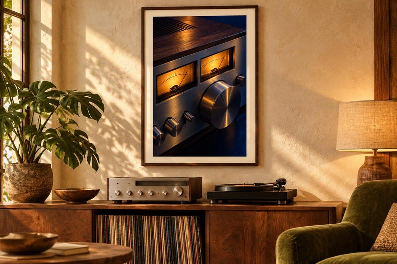 May include: A framed wall art print featuring a close-up of a vintage silver audio receiver with two illuminated amber analog VU meters, a large circular volume knob, and smaller control dials, set against a dark blue and wood-toned background.