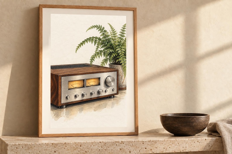 May include: A framed wall art print featuring a watercolor illustration of a vintage audio receiver with a wood grain finish and a silver control panel, positioned next to a potted green fern plant against a light cream background.