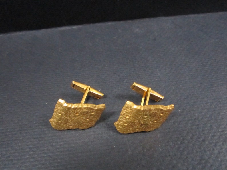Cuff links signed Haltoms Ft Worth