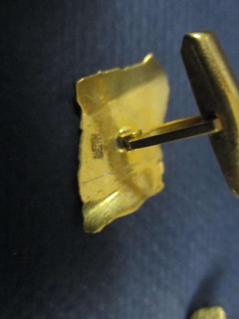 Cuff links signed Haltoms Ft Worth