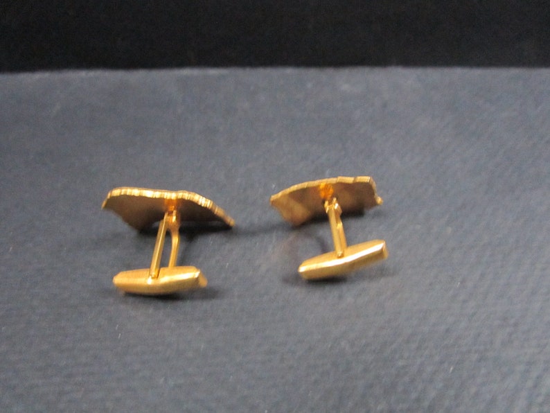 Cuff links signed Haltoms Ft Worth