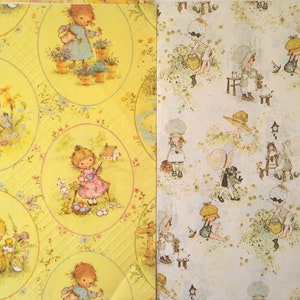 May include: Two sheets of vintage wrapping paper. One sheet is yellow with oval illustrations of children, flowers, and animals. The other sheet is white with repeating illustrations of children in bonnets and hats.