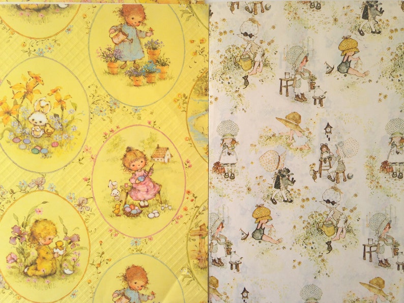 May include: Two sheets of vintage wrapping paper. One sheet is yellow with oval illustrations of children, flowers, and animals. The other sheet is white with repeating illustrations of children in bonnets and hats.