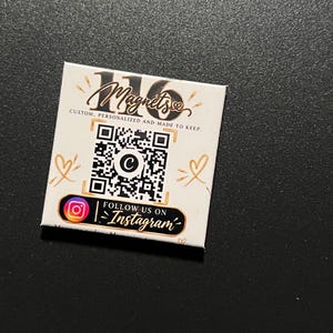May include: A square white magnet featuring the black text 16 Magnets, the phrase CUSTOM, PERSONALIZED AND MADE TO KEEP, a central QR code with a C icon, and a black bar with an Instagram logo and the text FOLLOW US ON Instagram.