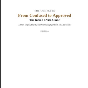 以下が含まれることがあります： 白地のブックカバーに黒と金の文字で「THE COMPLETE, From Confused to Approved, The Indian e-Visa Guide, A Plain-English, Step-by-Step Walkthrough for First-Time Applicants, 2026 Edition」と書かれています。テキストはページの中央に配置されています。