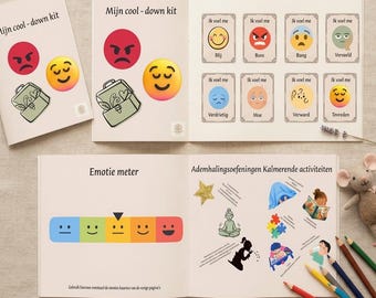 Può includere: Un libro di attività in lingua olandese intitolato Mijn cool-down kit contenente carte delle emozioni con volti illustrati, un misuratore di emozioni con volti colorati e pagine che descrivono esercizi di respirazione e attività.