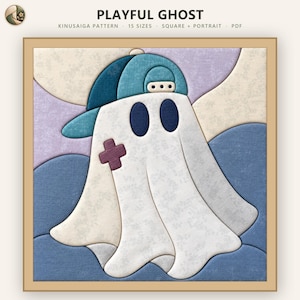 May include: A Kinusaiga pattern titled PLAYFUL GHOST featuring a white ghost wearing a teal baseball cap, with two dark blue oval eyes and a small purple cross patch on its side, set against a background of layered blue and lavender shapes.