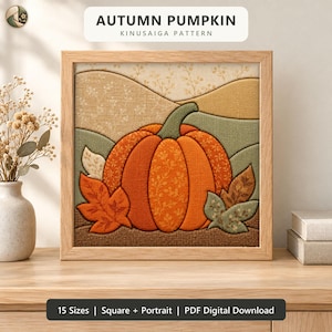 May include: A square framed Kinusaiga art piece featuring an orange pumpkin with a green stem, surrounded by autumn leaves and rolling hills in shades of beige, tan, and sage green. The artwork displays the text AUTUMN PUMPKIN KINUSAIGA PATTERN.