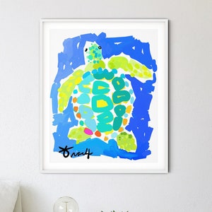 May include: A framed abstract painting of a green and blue sea turtle on a blue background. The artist's signature is visible in the bottom right corner of the painting.