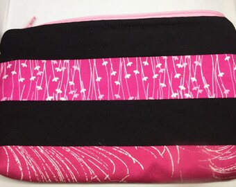 Pink and black striped cosmetic bag