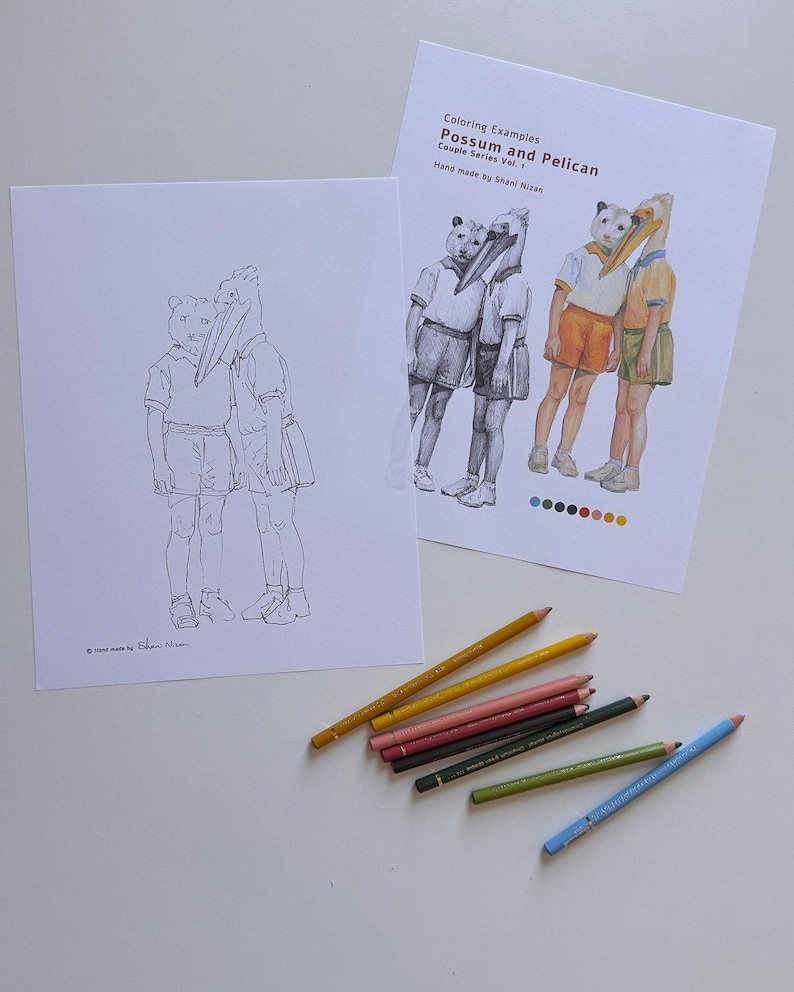 May include: Two printed sheets featuring line art and colored illustrations of a possum and a pelican with human bodies, titled "Coloring Examples Possum and Pelican Couple Series Vol. 1 Hand made by Shani Nizan," accompanied by six colored pencils.