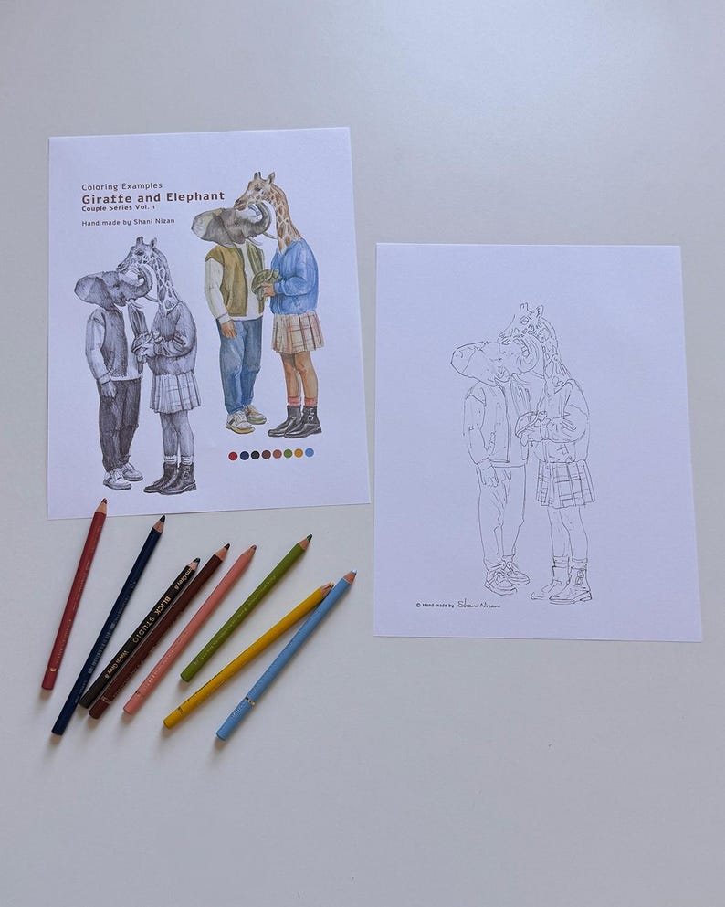 May include: Two sheets of paper featuring line art and coloured illustrations of a giraffe and elephant couple. One sheet shows the characters in full colour with the text "Coloring Examples Giraffe and Elephant Couple Series Vol. 1". Seven coloured pencils are arranged below.