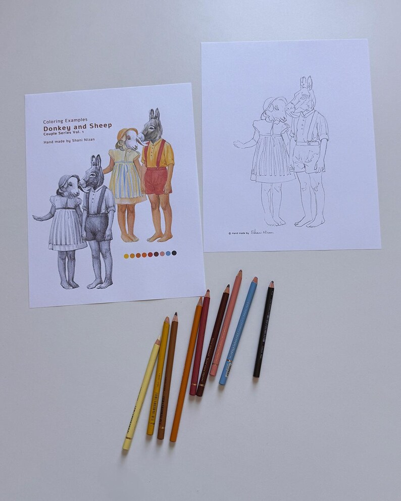 May include: Two sheets of paper featuring line art of a child with a sheep head and a child with a donkey head. One sheet shows colored examples with the text Coloring Examples Donkey and Sheep Couple Series Vol. 1. Eight colored pencils are arranged below.