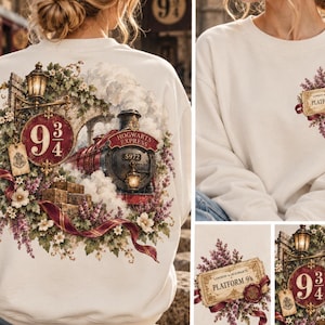 May include: A cream-colored crewneck sweatshirt featuring a large back graphic of the Hogwarts Express train, a Platform 9 3/4 sign, and floral accents. The front chest displays a smaller graphic of a Platform 9 3/4 ticket surrounded by purple flowers.