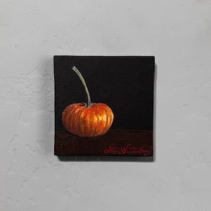 May include: A small, orange pumpkin with a green stem sits on a dark brown surface against a black background. The painting is signed "Gray Henderson" in the bottom right corner.