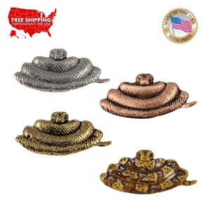 May include: Four coiled snake figurines in different finishes: silver, copper, gold, and painted brown with yellow accents.  Each figurine is about 3 inches long.