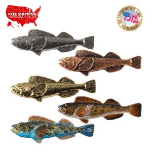 May include: Five metal fish figurines in different colors: silver, copper, gold, brown, and blue. Each fish has a detailed design and is made in the USA.