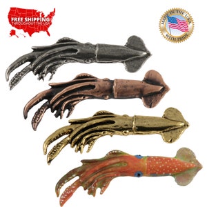 May include: Four squid figurines in different finishes: pewter, copper, gold, and painted. Each squid has ten tentacles and a detailed body.