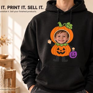 May include: A black hooded sweatshirt featuring a graphic of a child's face inside a pumpkin costume. The design includes a green stem, orange pumpkin body, black boots, and a purple jack-o'-lantern bucket. Text reads: BUY IT. PRINT IT. SELL IT.