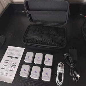 May include: A set of six white rectangular motion tracking sensors with the purple KILIKO logo, a black zippered carrying case with an internal mesh pocket, a white charging cable, a black multi-port charging cable, and a printed instruction sheet.