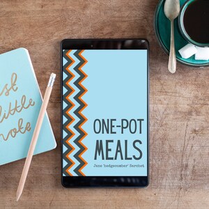 May include: A blue and orange chevron pattern on the cover of a book titled "One-Pot Meals" by Jane "hedgecomber" Sarchet.