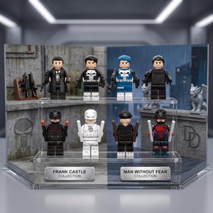 May include: A display case containing eight miniature figures arranged on two clear acrylic shelves. The top shelf features four figures with weapons, while the bottom shelf holds four figures with batons. Two metal plaques read FRANK CASTLE COLLECTION and MAN WITHOUT FEAR COLLECTION.