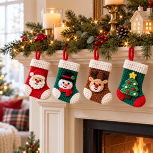 May include: Four crocheted Christmas stockings hanging in a row. The first is red with a Santa Claus face, the second is green with a snowman, the third is brown with a reindeer, and the fourth is green with a decorated Christmas tree.