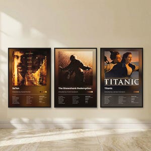 May include: Three framed movie posters featuring Se7en, The Shawshank Redemption, and Titanic. Each poster displays a central film scene, the title, director, cast list, release date, runtime, and genre, all set against a dark, gradient background.