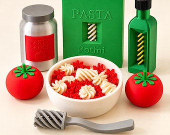 May include: A set of toy food items including a silver jar labeled PASTA SAUCE, a green box labeled PASTA Rotini, a green bottle, two red tomatoes, a white bowl filled with red and white pasta shapes, and a gray spiral-textured utensil.